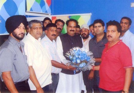 J.s Nayol facilitated by a bouquet of flowers by the newly appointed state president J& K Harminder Singh and members